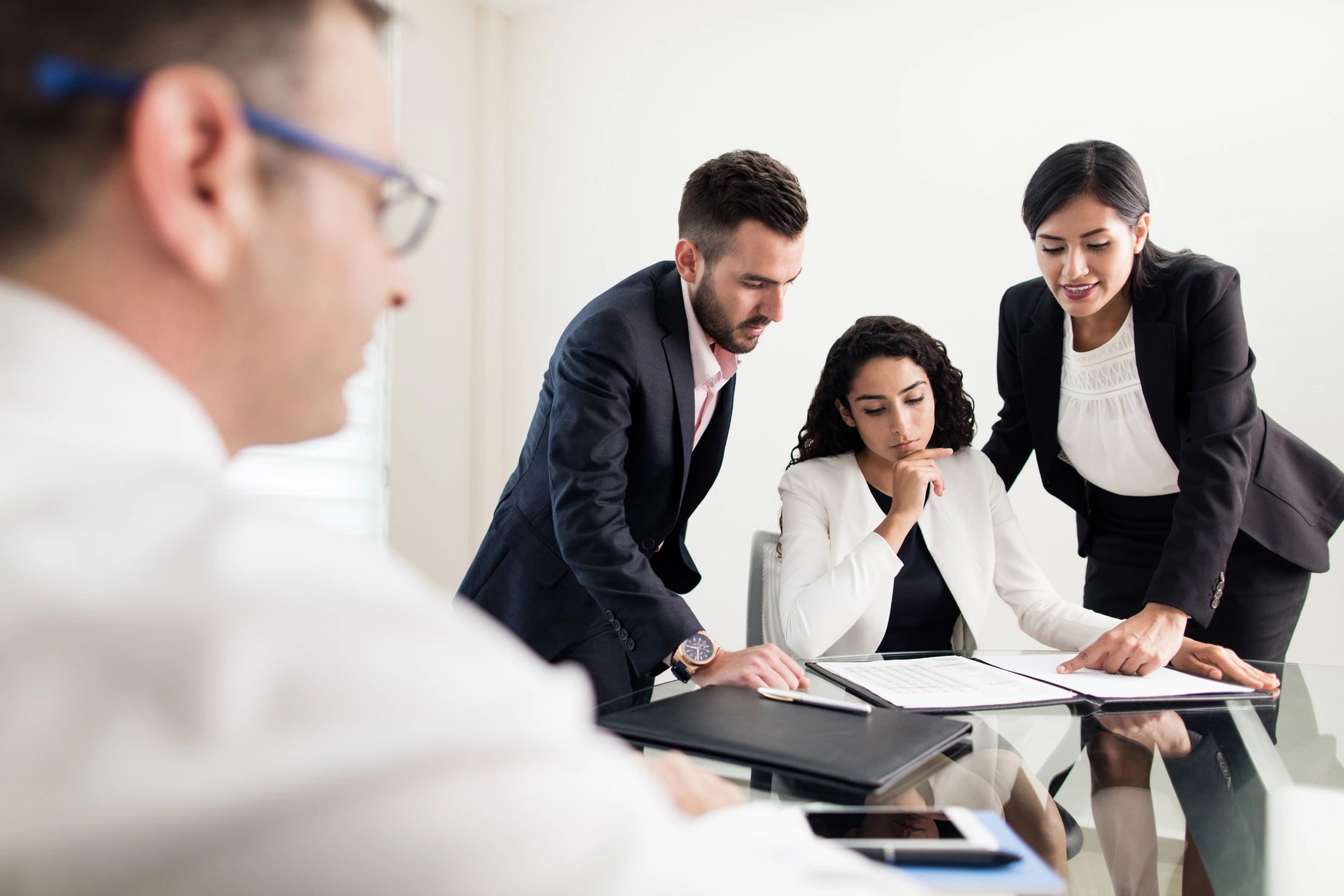 Attorney consultation meeting with clients in an office